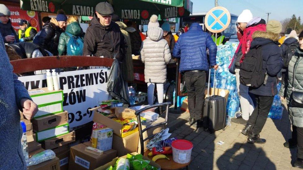 People offering free food and water in Poland