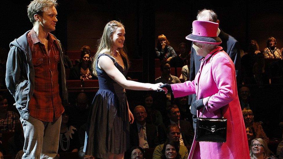 Queen Elizabeth II speaks to Romeo and Juliet actors, Sam Troughton (L) and Mariah Gale during her visit to the Royal Shakespeare Theatre on March 4, 2011 in Stratford-upon-Avon,