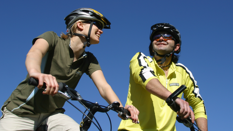 Woman and man on bicycles