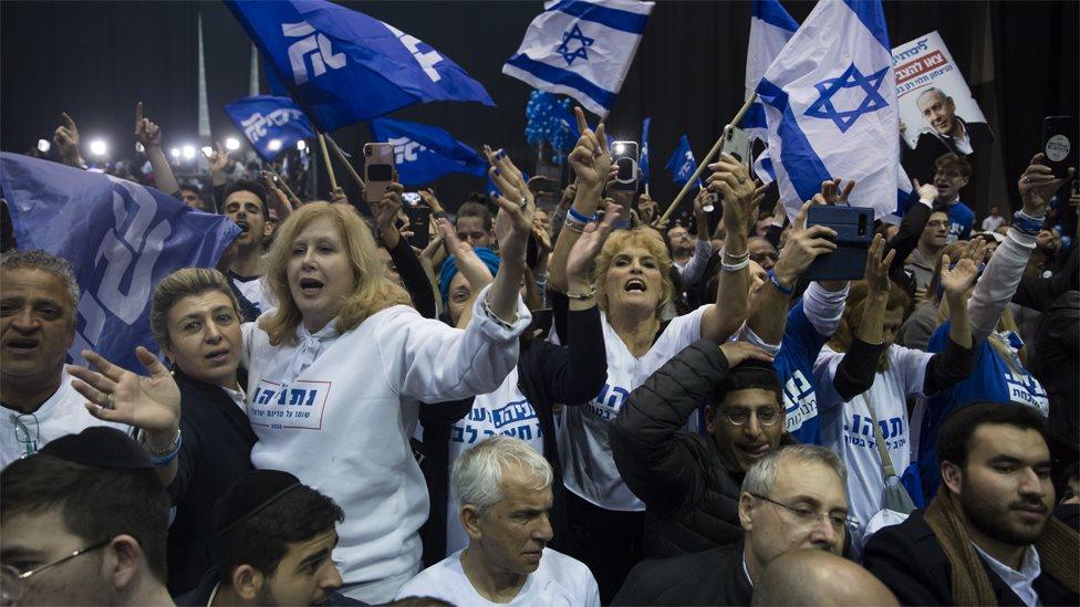 Supporters of Israel's Likud party celebrate at its election headquarters on 3 March 2020