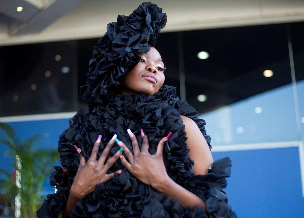 A model attends judging of the fashion contest at Durban July horse racing event, in Durban, South Africa, July 2, 2022