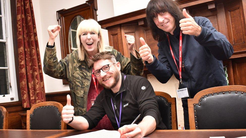 Holly (left) and David Blackwell (right) from Lancaster Music Co-op and band The Lovely Eggs with councillor Nick Wilkinson (centre)