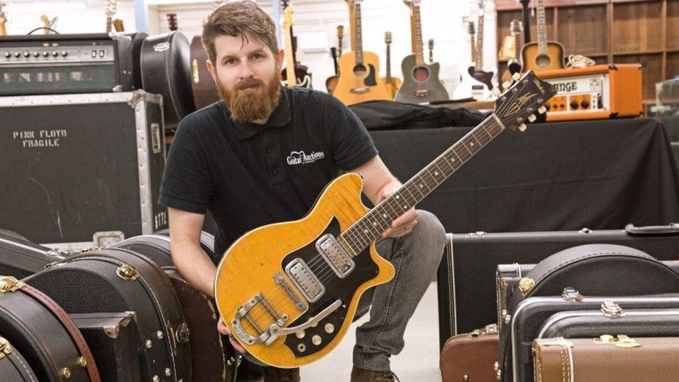 Luke Hobbs with George Harrison's Maton guitar