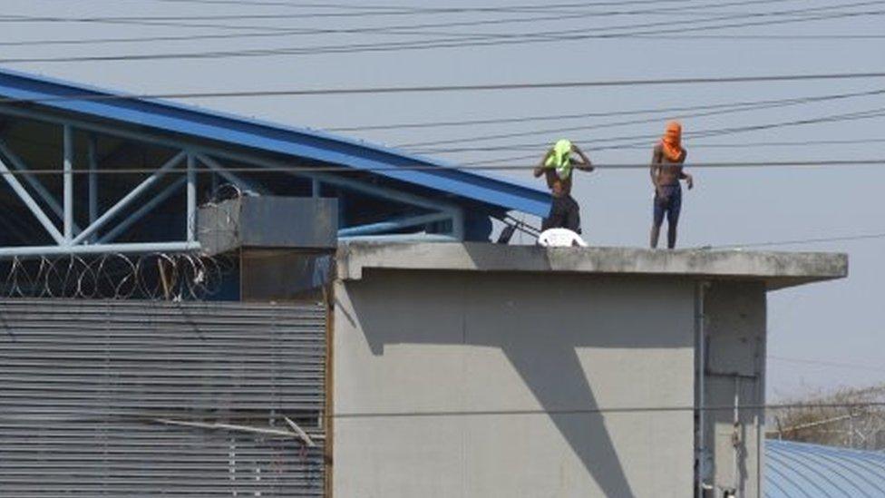 Several inmates remain on the roofs of the Litoral prison in Guayaquil, Ecuador, 28 September 2021.