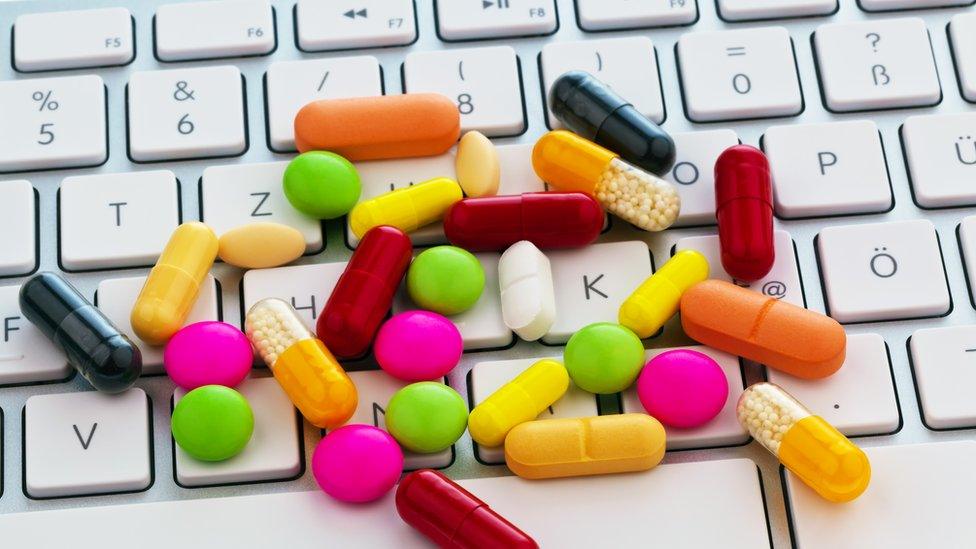 Pills on a keyboard