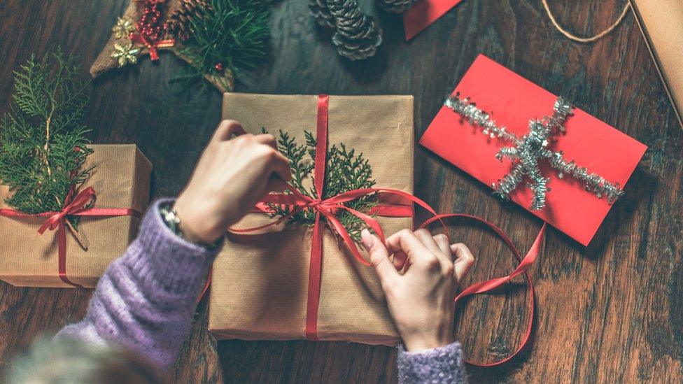 Child wrapping presents