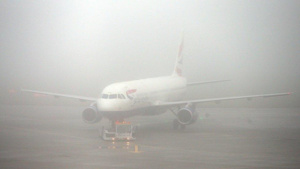 British Airways plane in the fog at Terminal 5 of Heathrow Airport, as thick fog was disrupting flights at UK airports for a second day.