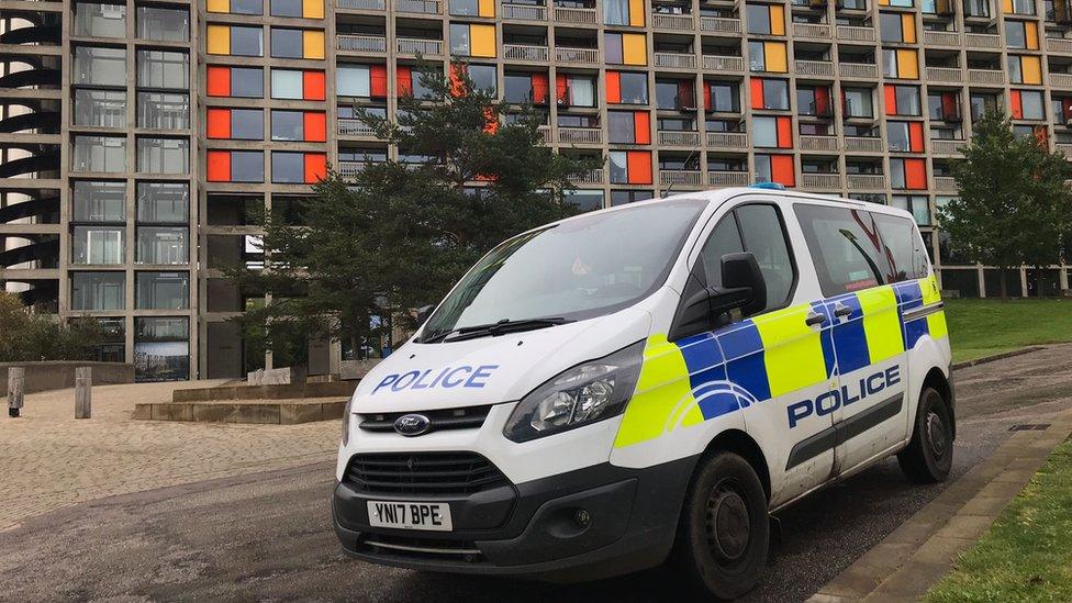 A police van outside the flats