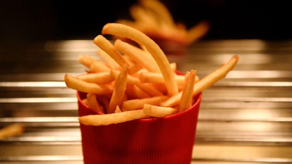 French fries sit in a reusable container at a McDonald's restaurant in Levallois-Perret, near Paris.