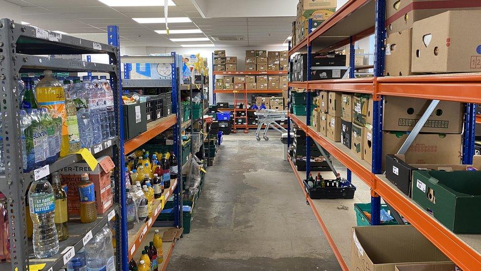 Shelves stacked with products at Basingstoke Foodbank