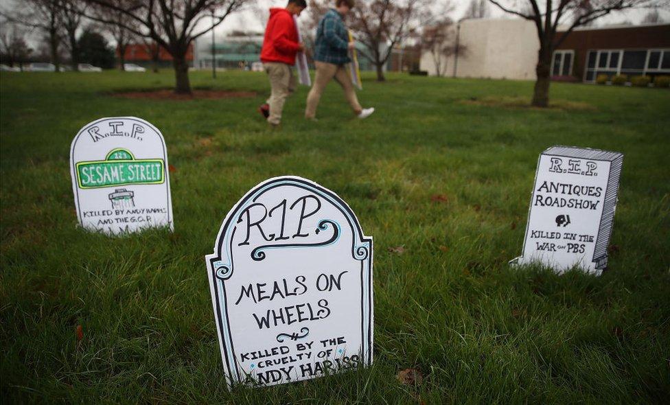 Protesters at a Republican congressman's town hall meeting laid out gravestones for Meal on Wheels and popular public broadcasting programmes