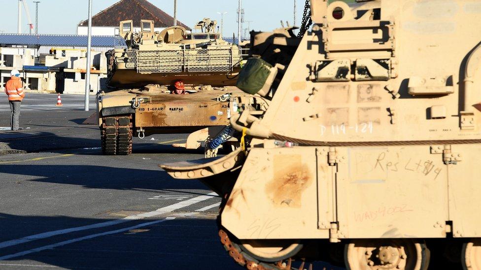 US Military vehicles are unloaded from a transport ship in the harbour in Bremerhaven