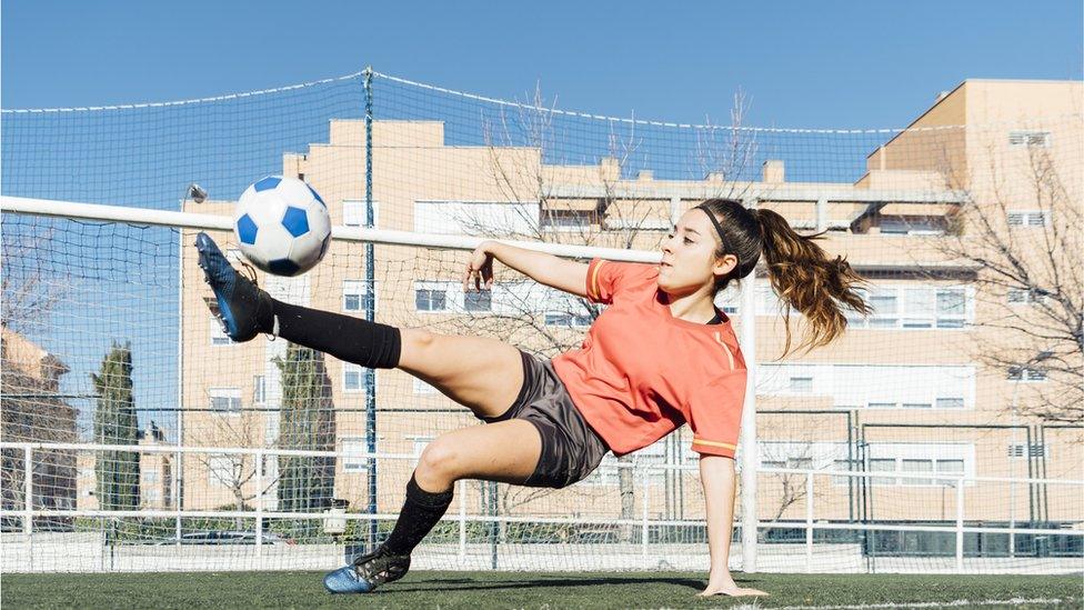 girls-playing-football.