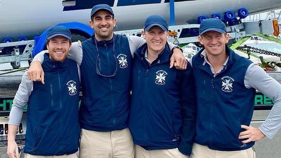 Brothers n Oars rowing team in front of their boat