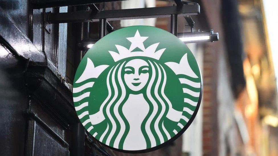 A logo outside a branch of Starbucks