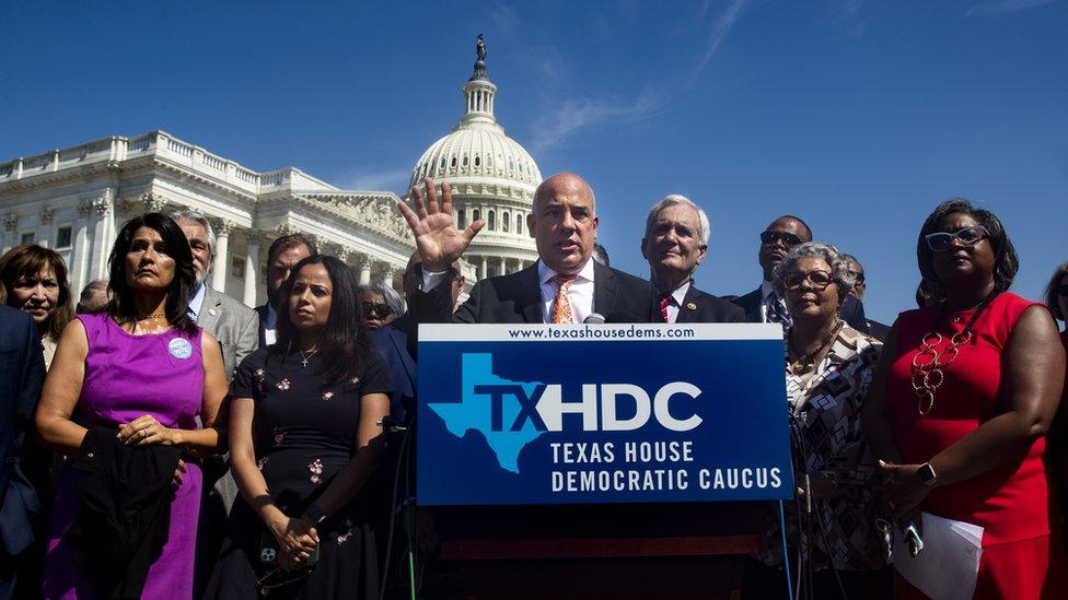 Chair of the Texas House Democratic Caucus Chris Turner (C) speaks at a news conference held by Democratic members of the Texas state legislature