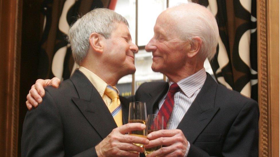 Percy Steven shares champagne with Roger Lockyer on their wedding day