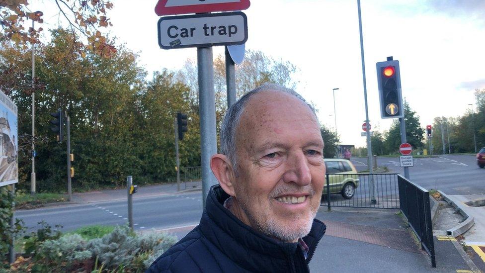 John King standing in a road