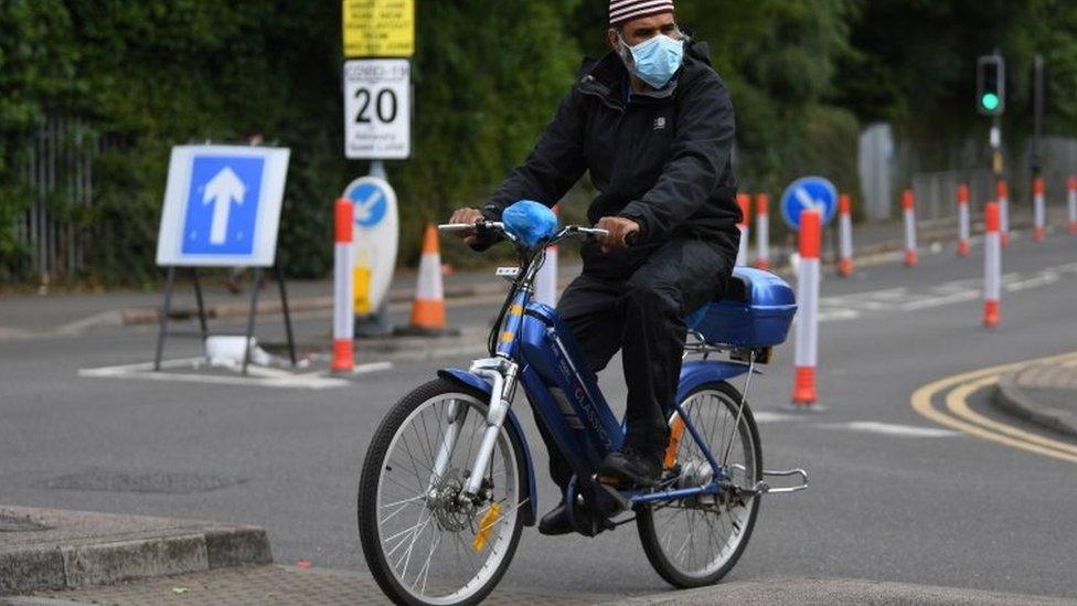 A cyclist wearing a facemask in Leicester