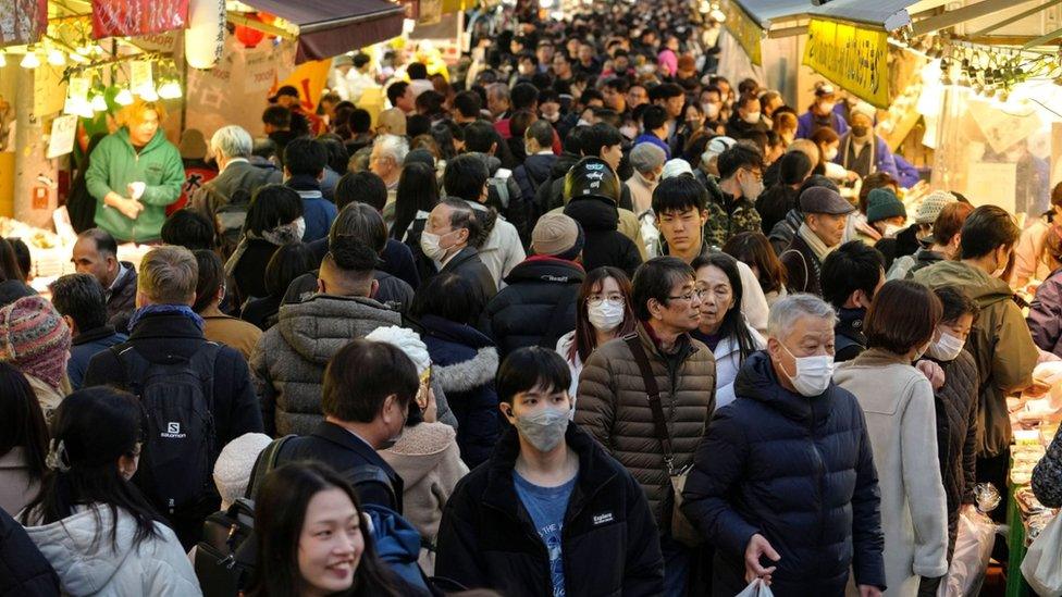 Shoppers in Tokyo, Japan.