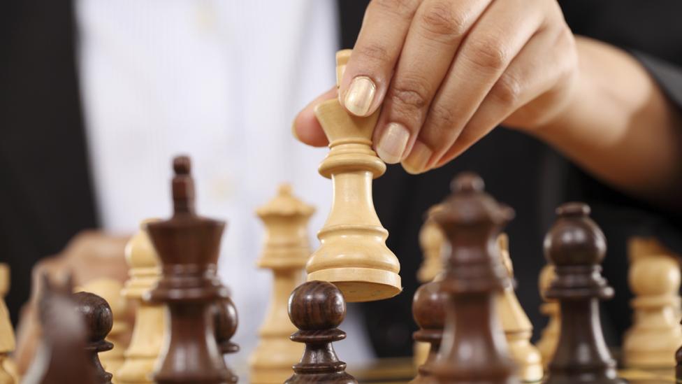 Woman playing chess