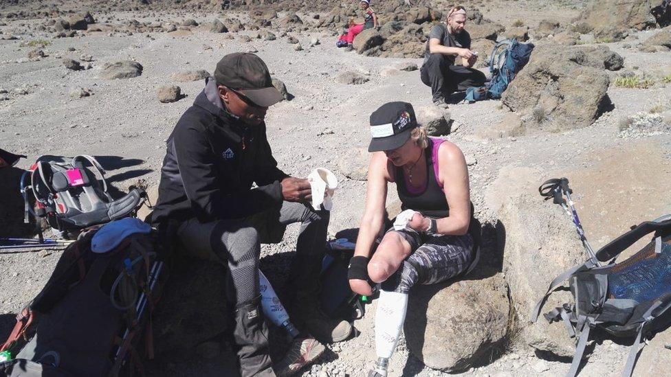 Corinne Hutton receiving medical attention on Kilimanjaro