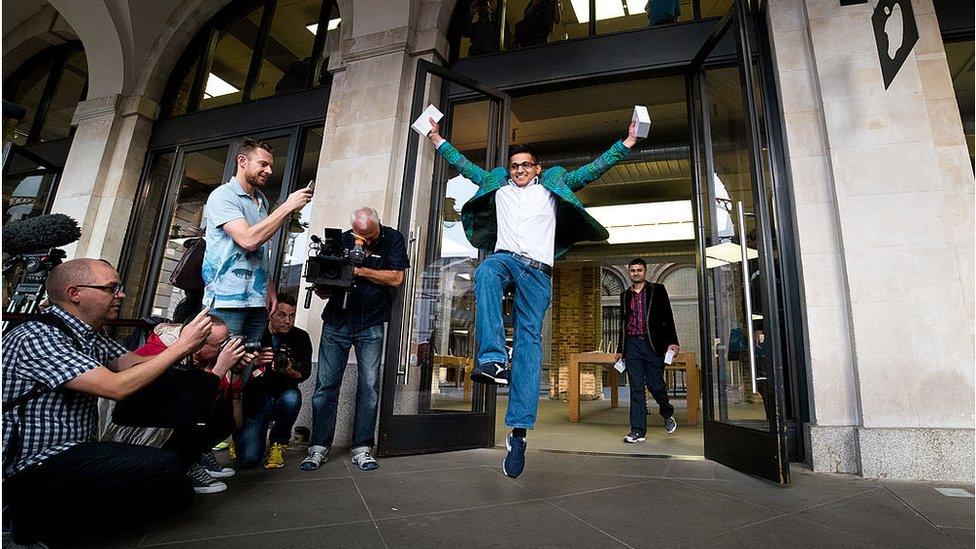 Jamael Ahmed, the first to purchase the iPhone 6 at Apple Covent Garden's launch event in 2014