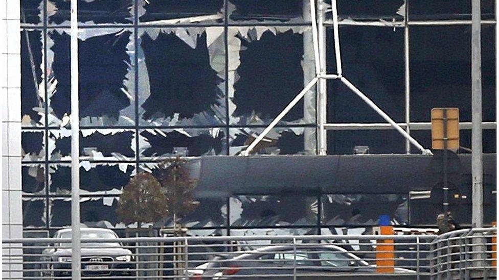 Broken windows seen at the scene of explosions at Zaventem airport near Brussels, Belgium, March 22, 2016