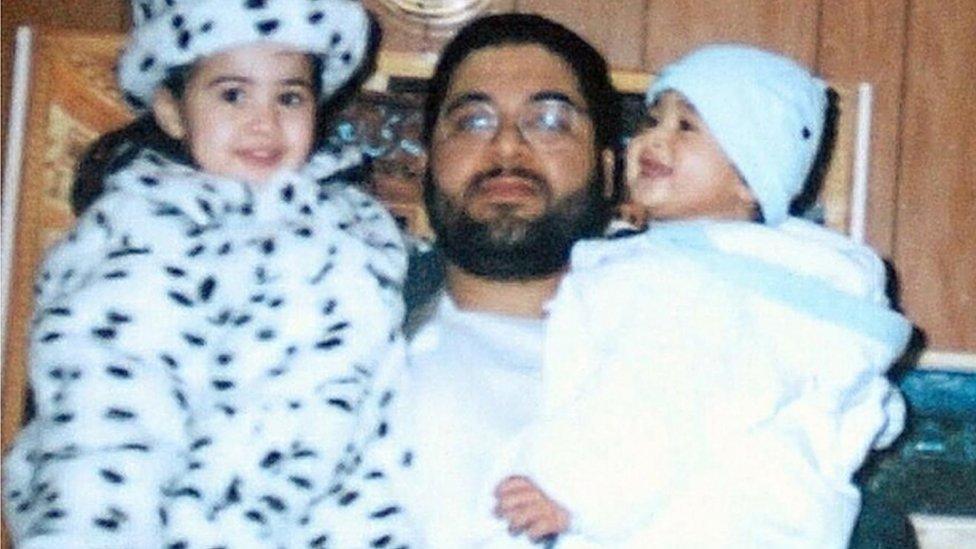 Undated photo of Shaker Aamer with two of his children, son Michael (right) and daughter Johninh