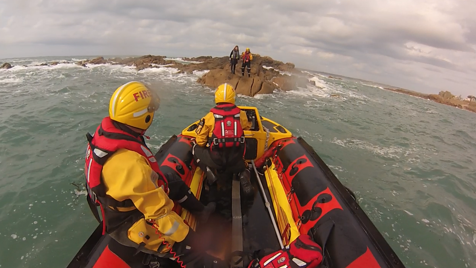 Woman rescued from rocks