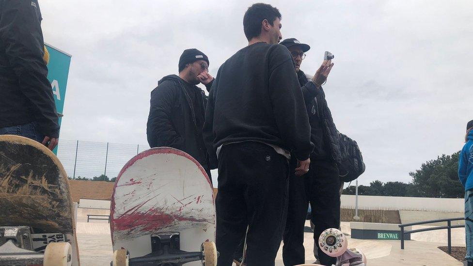 People attend the opening of the Les Quennevais skate park