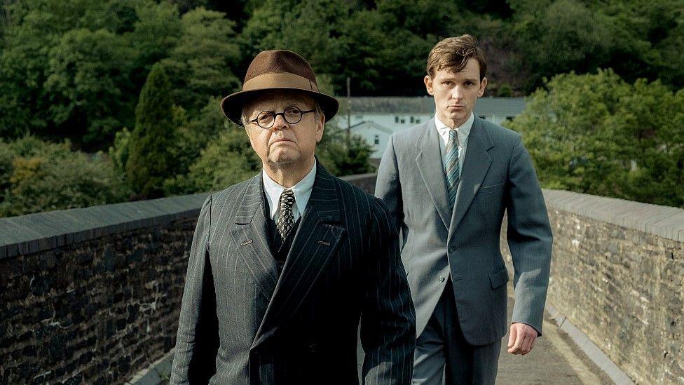 Toby Jones and Harry Lawtey cross Y Bont Mawr bridge in Pontrhydyfen, Neath Port Talbot, in one of the scenes from the film Mr Burton