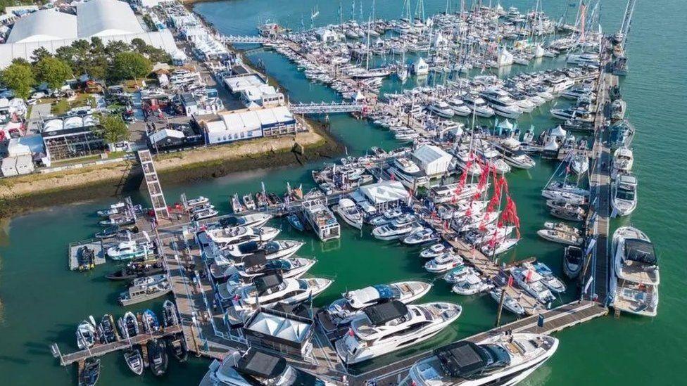 Lines of motor and sail boats attached to pontoons branching off Southampton's waterfront