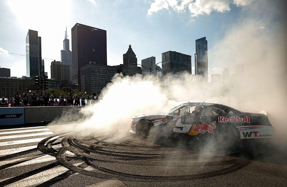 Shane van Gisbergen celebrates with a burnout after winning the NASCAR Xfinity Series in Chicago.