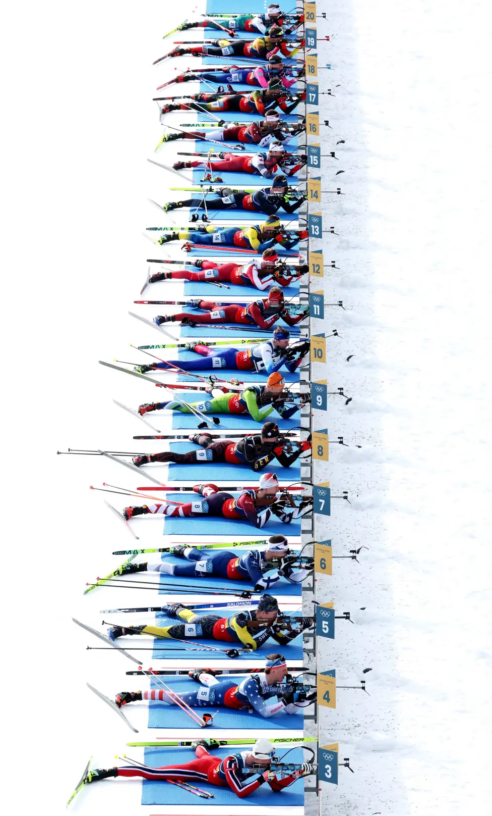 Biathletes prepare to shoot during the 4x6km mixed relay in Antholz-Anterselva