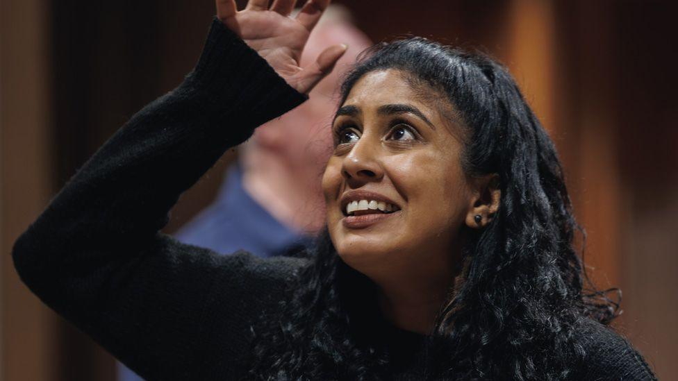 Purvi Parmar with one arm in the air in rehearsals as Olivia in Twelfth Night