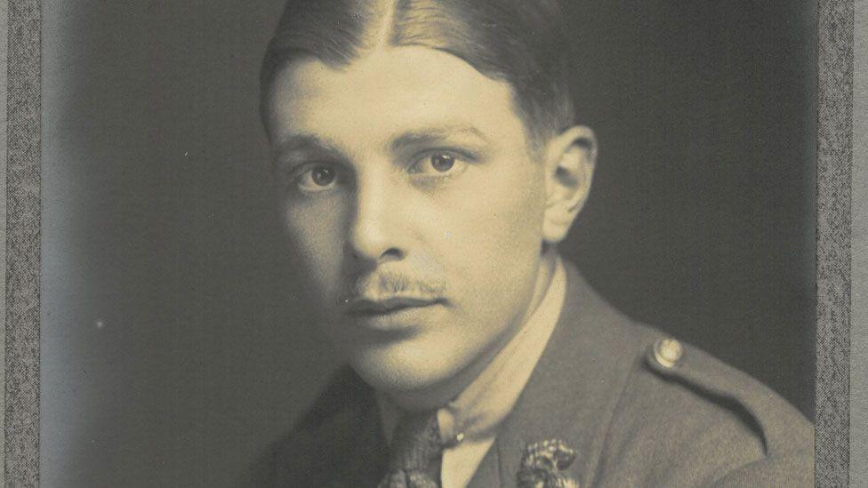 A black-and white image of (Edward) Roy Pallett in his Army officer uniform. He has slicked back hair and a slight moustache.