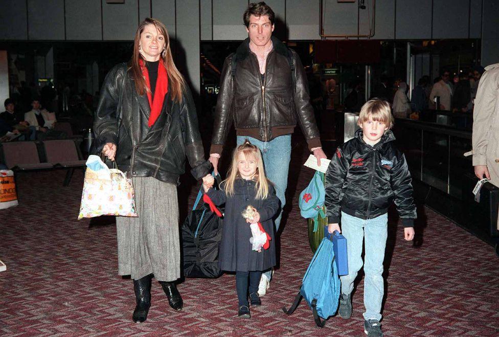 Christopher Reeve and his family photographed in an airport