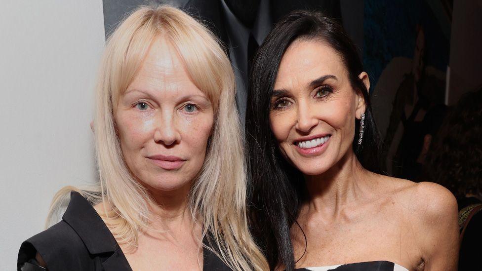 Pamela Anderson and Demi Moore posing together at W Magazine's Annual Best Performances Party at Chateau Marmont on January 04, 2025 in Los Angeles