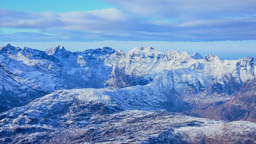 White snow covered rocky mountains.