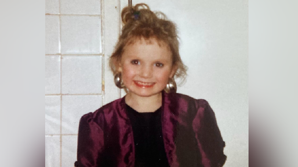 Michaela Allen as a seven-year-old girl