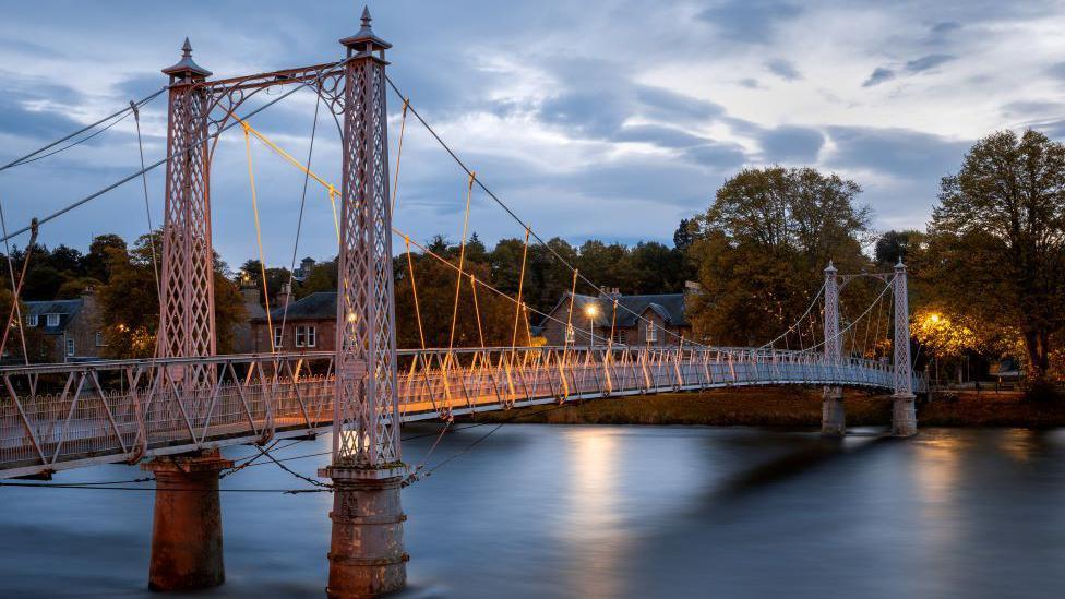 The infirmary footbridge in Inverness in evening twilight.