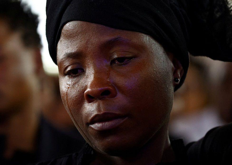 Esmerada Gonsalves, widow of murdered Podemos lawyer Elvino Dias , cries during his funeral at the Paroquia Nossa Senhora do Rosario church, in Laulane township, in Maputo.