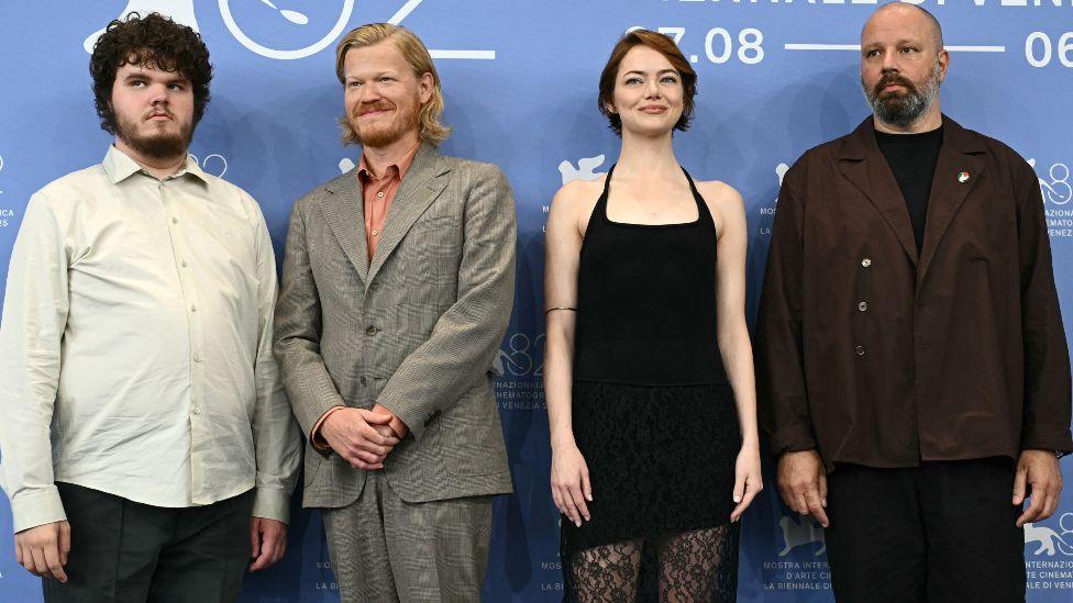 US actor Aidan Delbis, US actor Jesse Plemons, US actress Emma Stone and Greek director and screenwriter Yorgos Lanthimos attend a photocall for the movie "Bugonia" presented in competition at the 82nd International Venice Film Festival, at Venice Lido on August 28, 2025