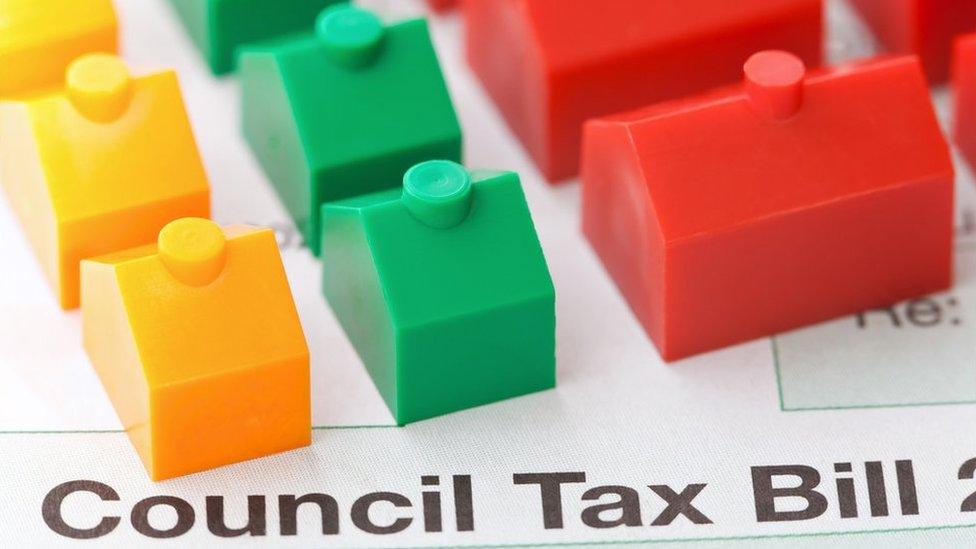 council tax bill with monoply pieces on top