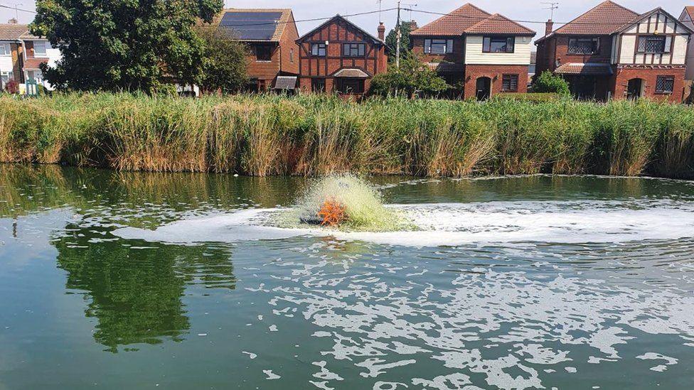 An aerator churning through the water at Canvey Lake.