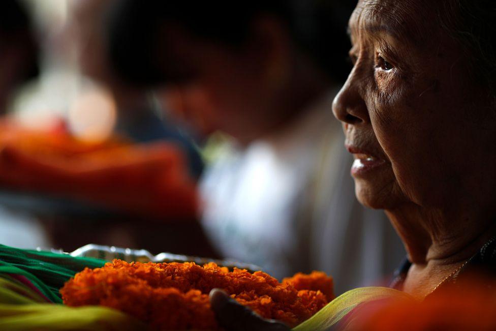 A Thai Buddhist devotee offers prayers to a Buddha statue during a merit-making ceremony to mark the New Year at the City Pillar Shrine in Bangkok, Thailand, 31 December 2024. 