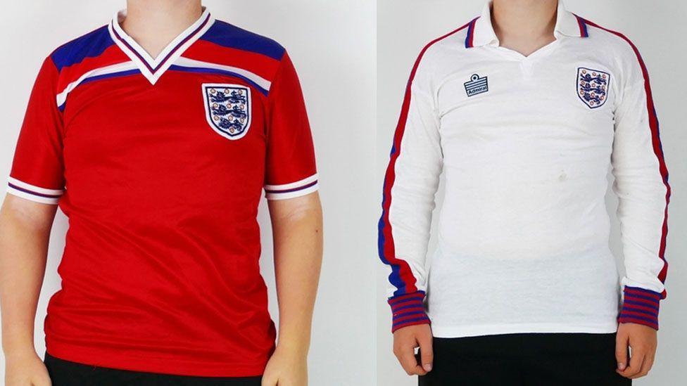 There are two photographs in this image. On the left is a photograph of a red England away shirt worn by Francis at the World Cup in Spain 1982. On the right is a white England shirt understood to have been worn on Francis' England debut in 1977. 