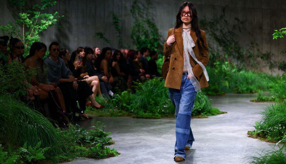 A model presents creations by Gucci at a fashion show in the Turbine Hall at Tate Modern, in London, Britain May 13, 2024. 