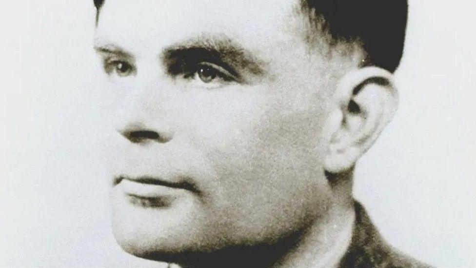 Black and white photo of Alan Turing
